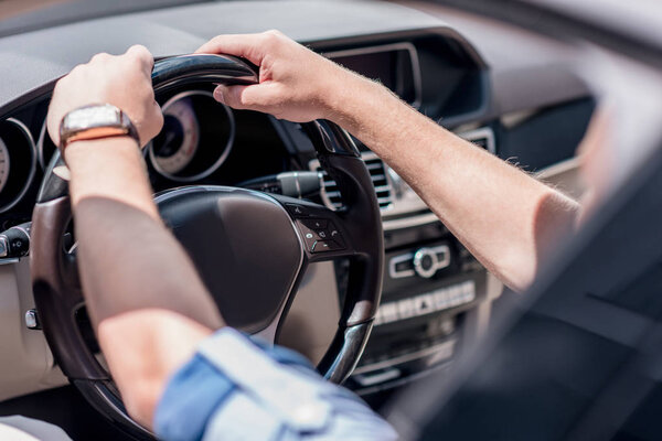 man driving car