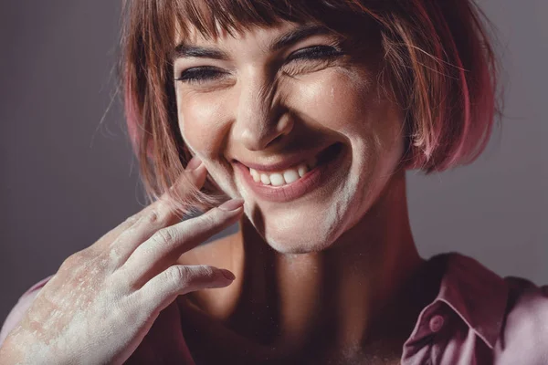 Cheerful girl with powder on face — Stock Photo, Image