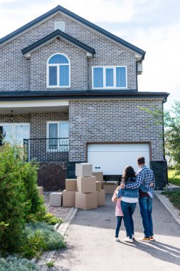 family looking at new house clipart