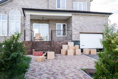 house with stacks of cardboard boxes clipart