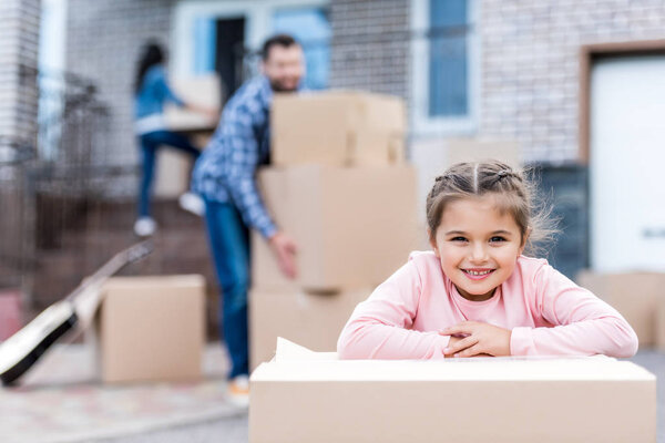 girl with cardboard box