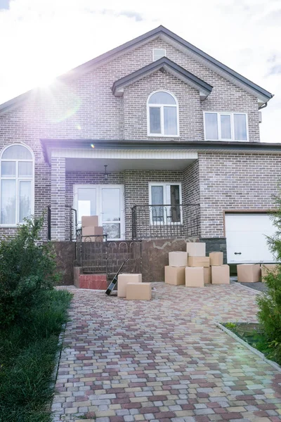 House with stacks of cardboard boxes — Stock Photo, Image