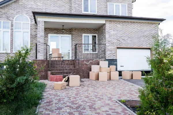 House with stacks of cardboard boxes — Stock Photo, Image