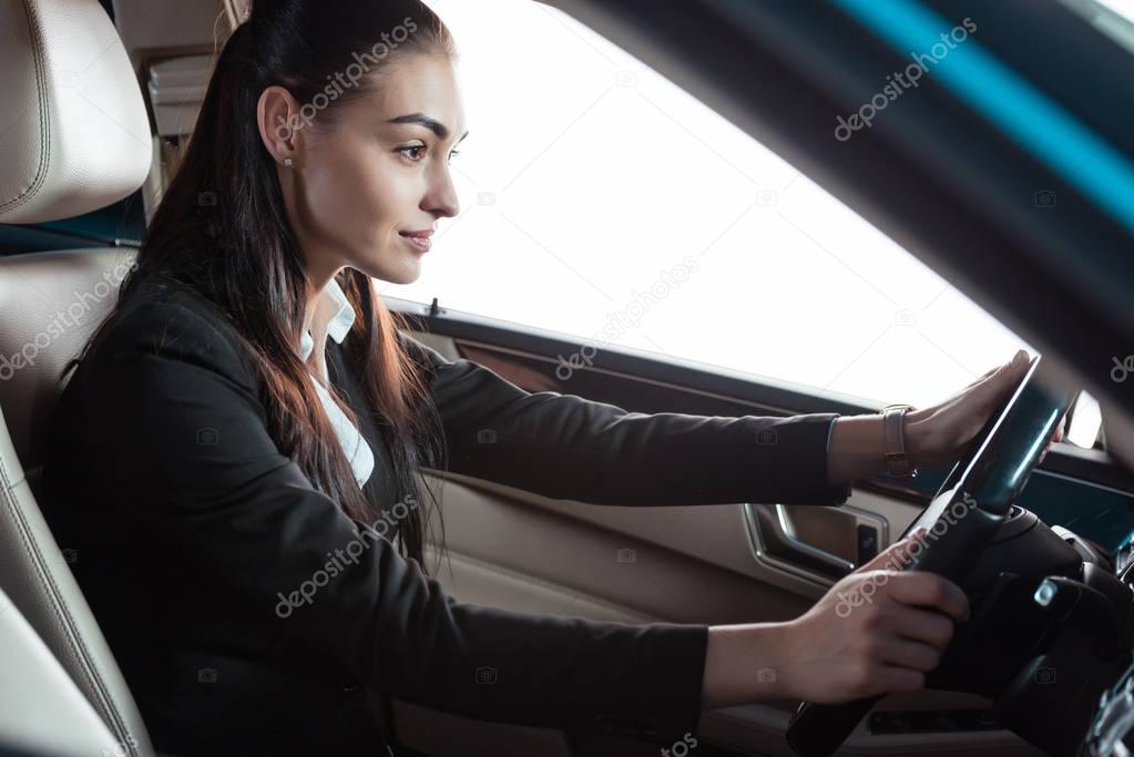 businesswoman driving car