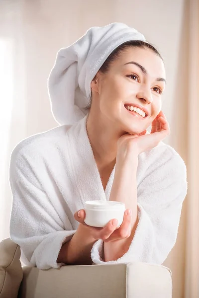 Woman holding jar of cream — Stock Photo, Image