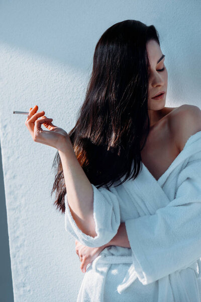 attractive woman smoking cigarette