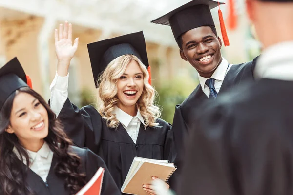 Students in graduation costumes — Stock Photo, Image