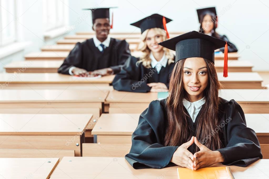 students in graduation costumes