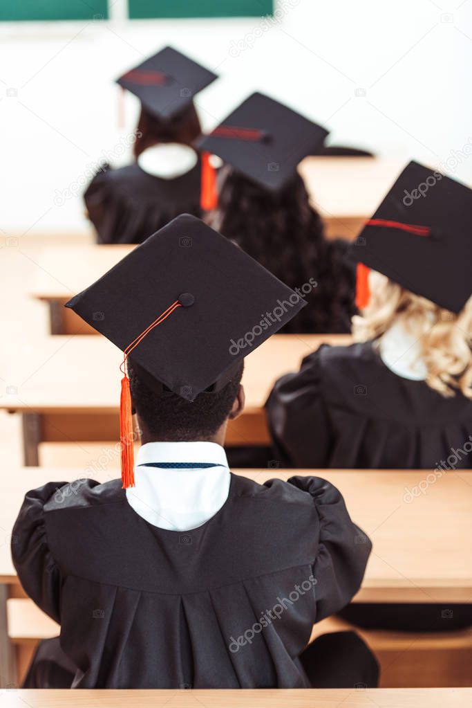 students in graduation hats