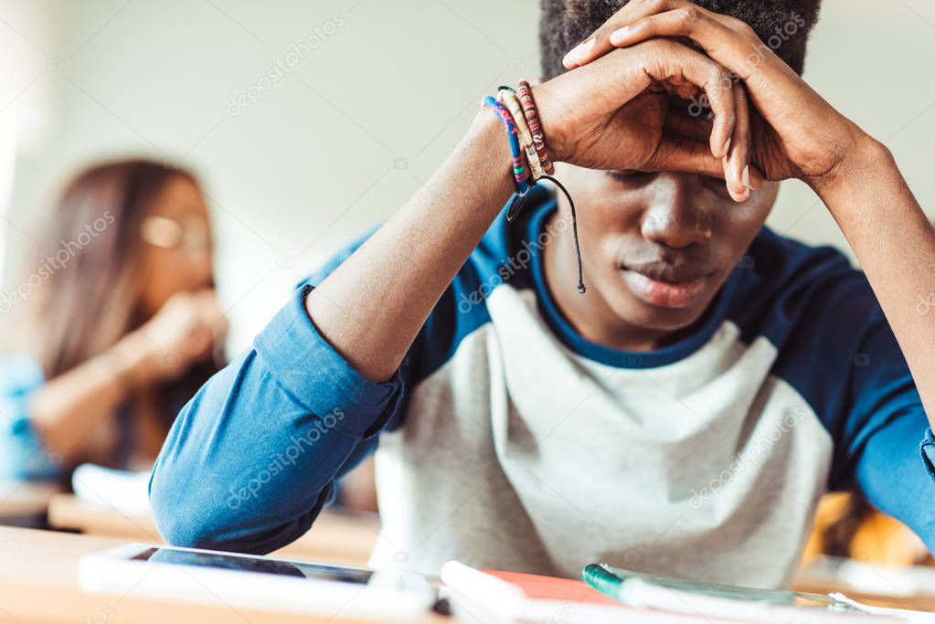 african american student sitting in class