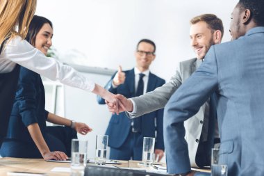 businesspeople shaking hands clipart