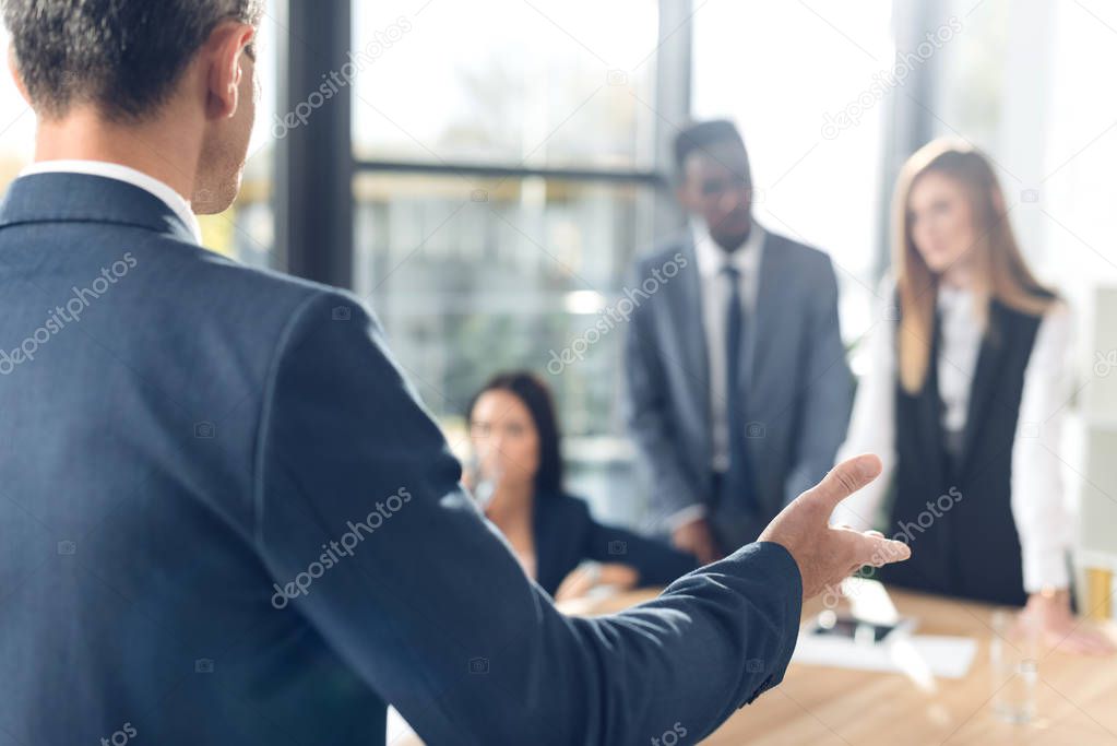 businessman talking to partners