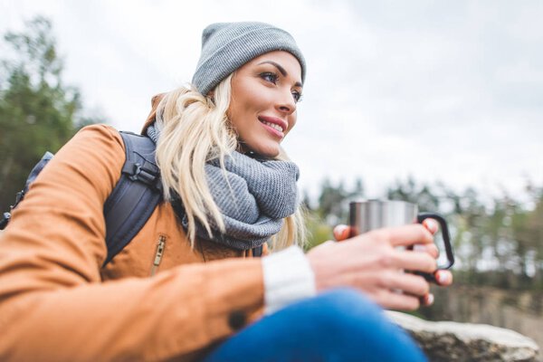 pensive woman with cup of tea
