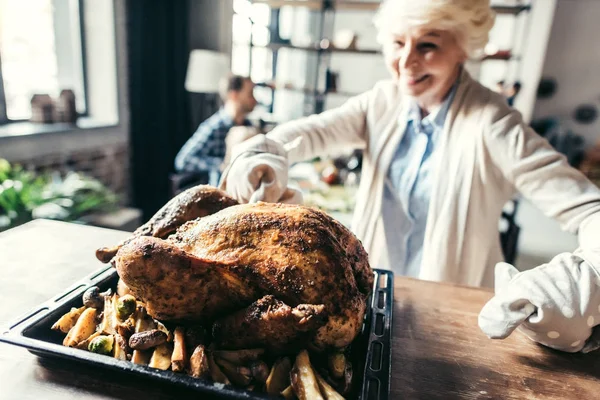 Woman with delicious turkey — Stock Photo, Image