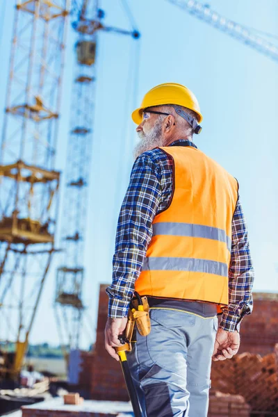 Worker in protective wear at construction site — Stock Photo, Image