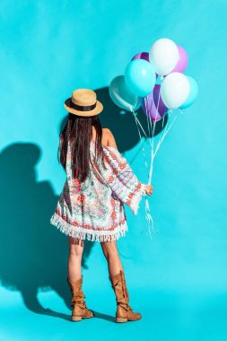 Hippie woman holding colored balloons  clipart
