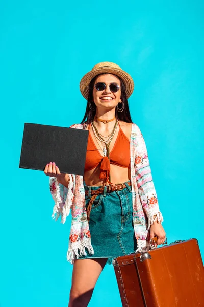 Bohemian traveler with black board and suitcase — Stock Photo, Image