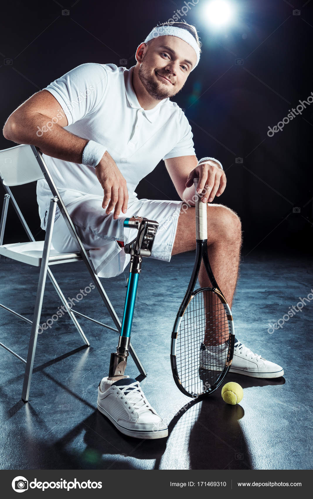 Paralympic Tennis Player Resting On Chair Stock Photo