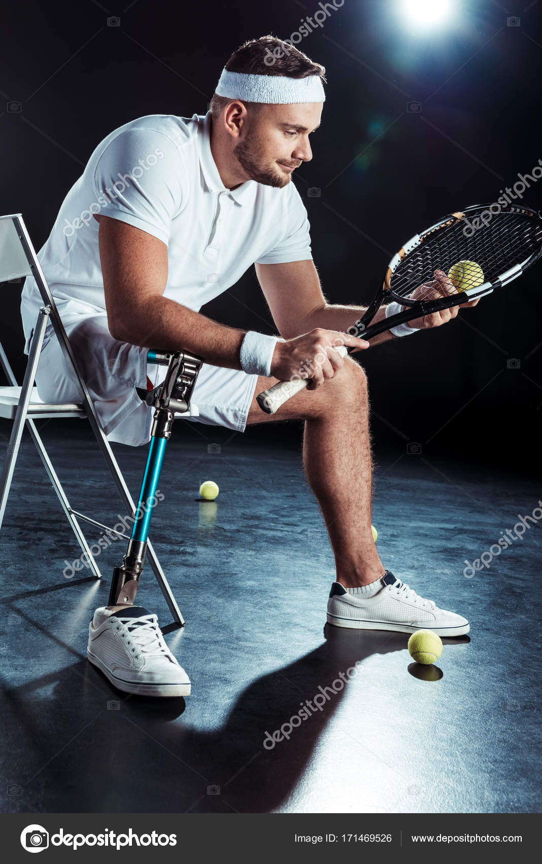 Paralympic Tennis Player Resting On Chair Stock Photo