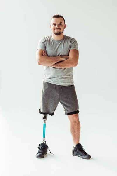 smiling man with leg prosthesis