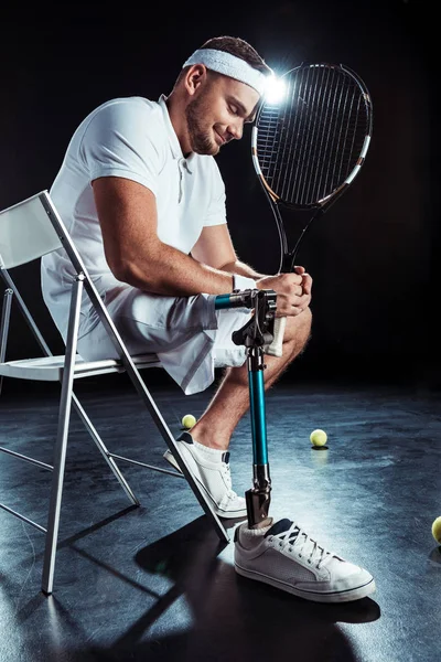 Paralympic tennis player resting on chair — Free Stock Photo