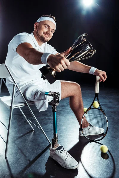 Paralympic tennis player with champion goblet — Free Stock Photo