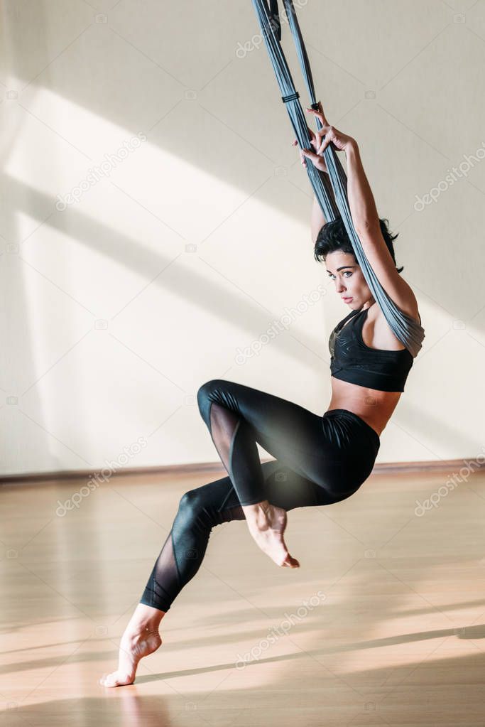 woman practicing acrobatic aerial dance