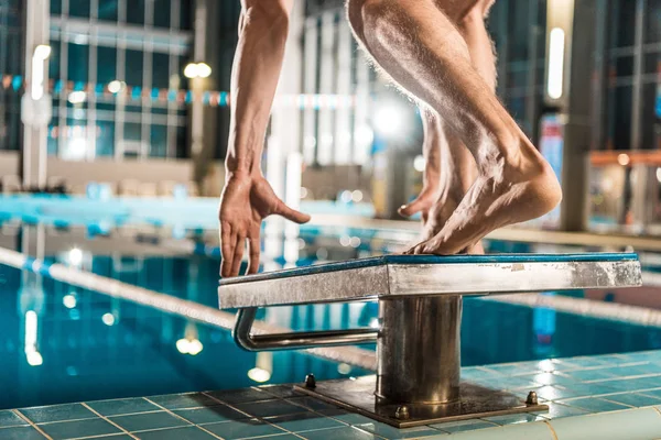 Swimmer on diving board ready to jump — Stock Photo, Image