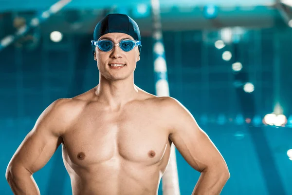 Handsome muscular swimmer — Stock Photo, Image