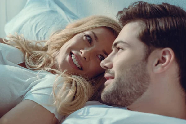 Couple relaxing in bed at morning — Stock Photo, Image