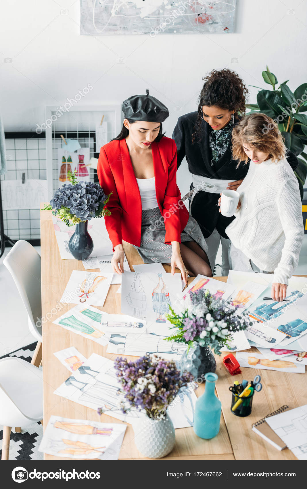 Fashion designers working with sketches — Stock Photo