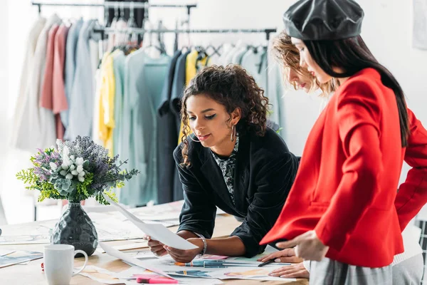 Fashion designers working with sketches — Stock Photo, Image