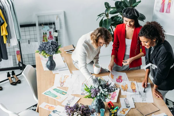 Fashion designers working with sketches — Stock Photo, Image