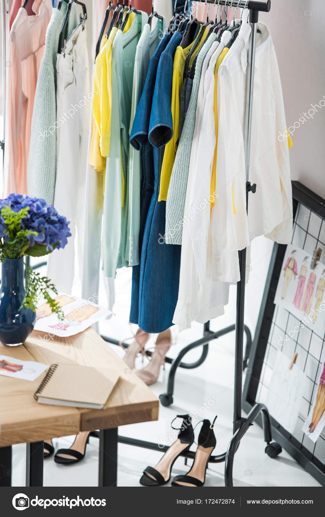 Fashionable clothes on hangers — Stock Photo © ArturVerkhovetskiy