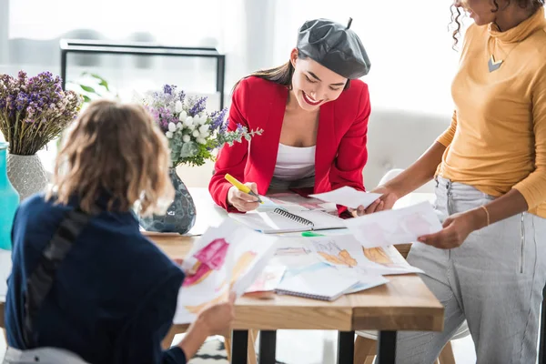 Fashion designers working with sketches — Stock Photo, Image