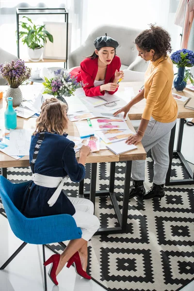 Fashion designers working with sketches — Stock Photo, Image