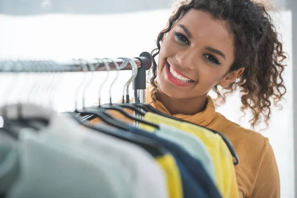 African american fashion designer with clothes — Stock Photo, Image