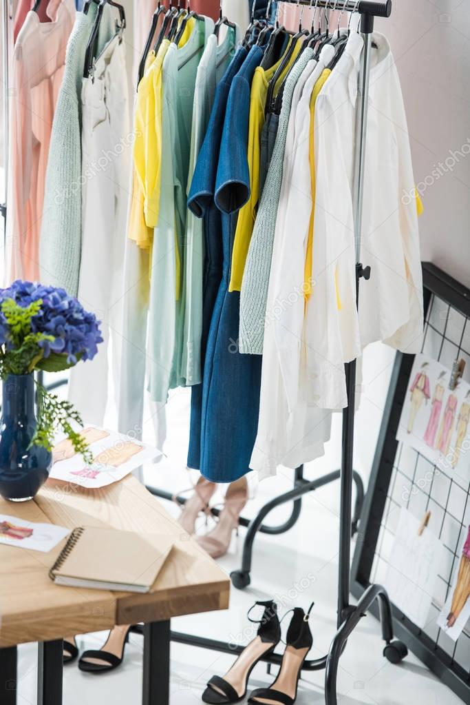 Fashionable clothes on hangers — Stock Photo © ArturVerkhovetskiy