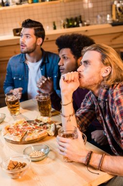 friends with pizza and beer in bar clipart