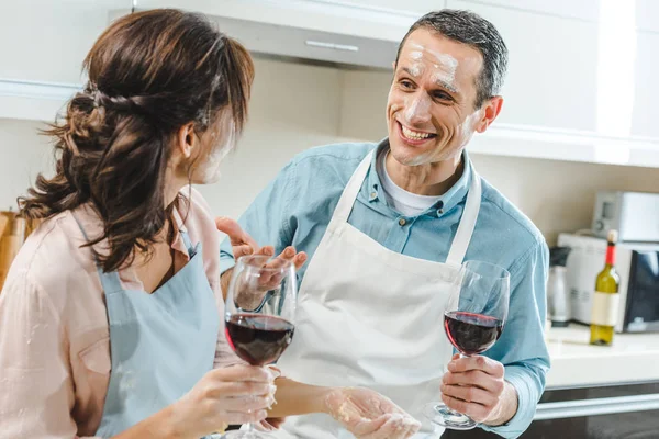 Couple in flour with wine — Stock Photo, Image