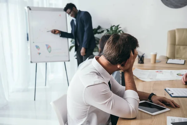 Exhausted Businesspeople Listening Presentation Office — Free Stock Photo