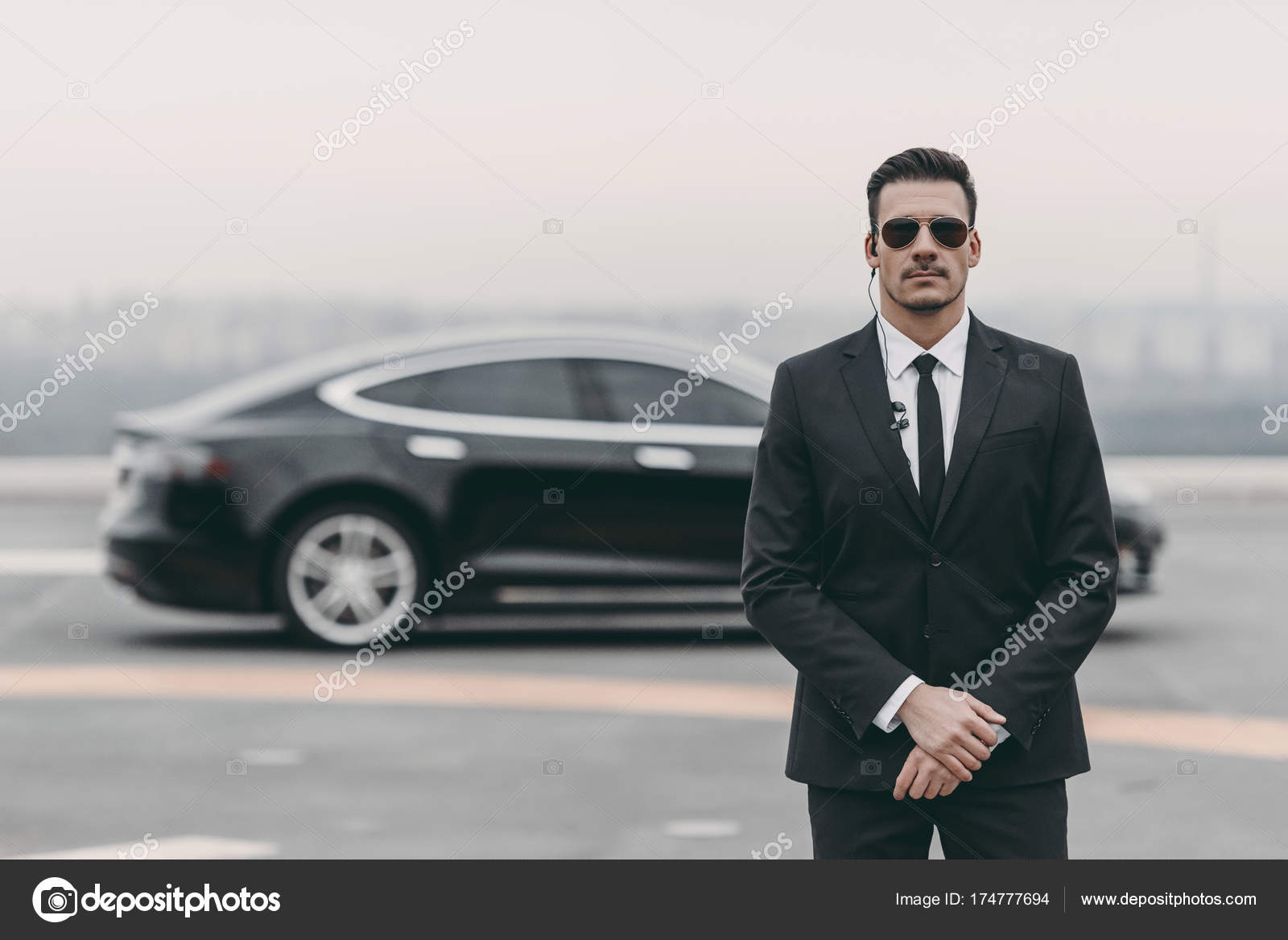 Serious Bodyguard Standing Sunglasses Security Earpiece Helipad Stock