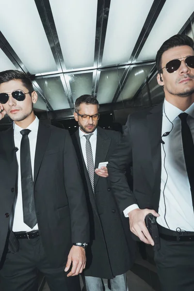 Businessman Looking Smartphone While Standing Bodyguards Elevator — Stock Photo, Image