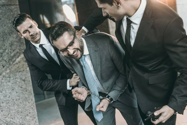 Cropped Image Security Guards Arresting Smiling Criminal — Stock Photo, Image