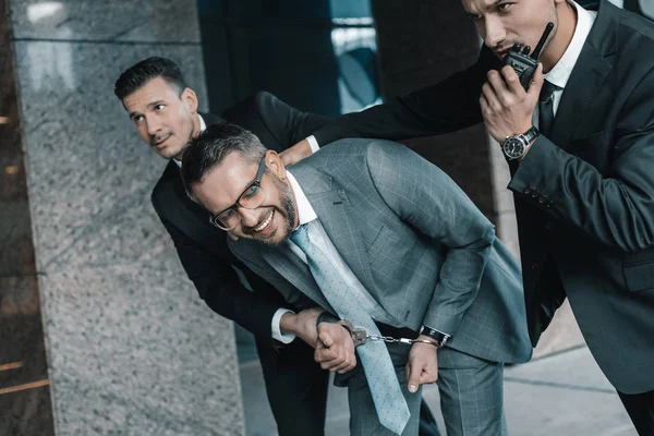 Cropped Image Security Guards Arresting Laughing Criminal — Stock Photo, Image