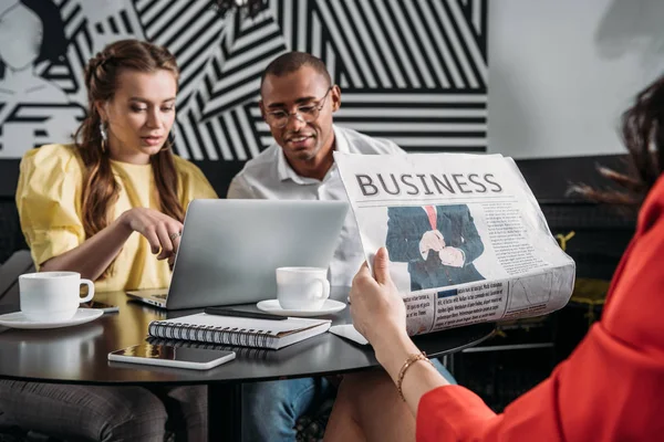 young successful business partners spending time in cafe