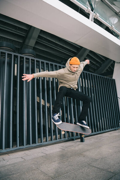 professional skateboarder performing trick in urban location
