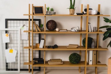 brown wooden shelves with stuff at home