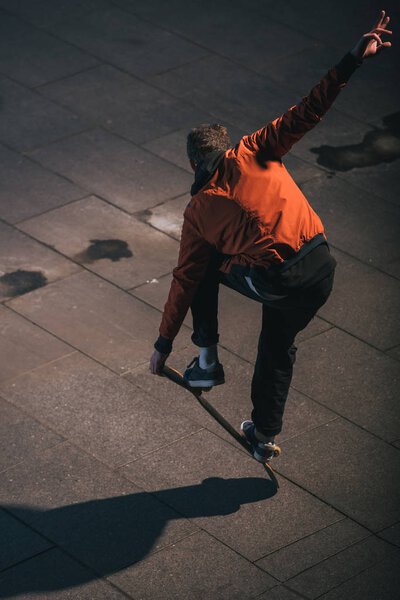 high angle view of skateboarder balancing on board