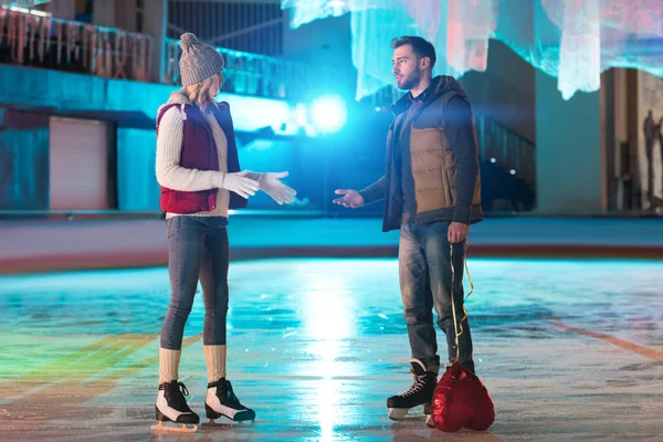 Young Couple Quarreling While Man Holding Heart Shaped Balloon Rink — Stock Photo, Image